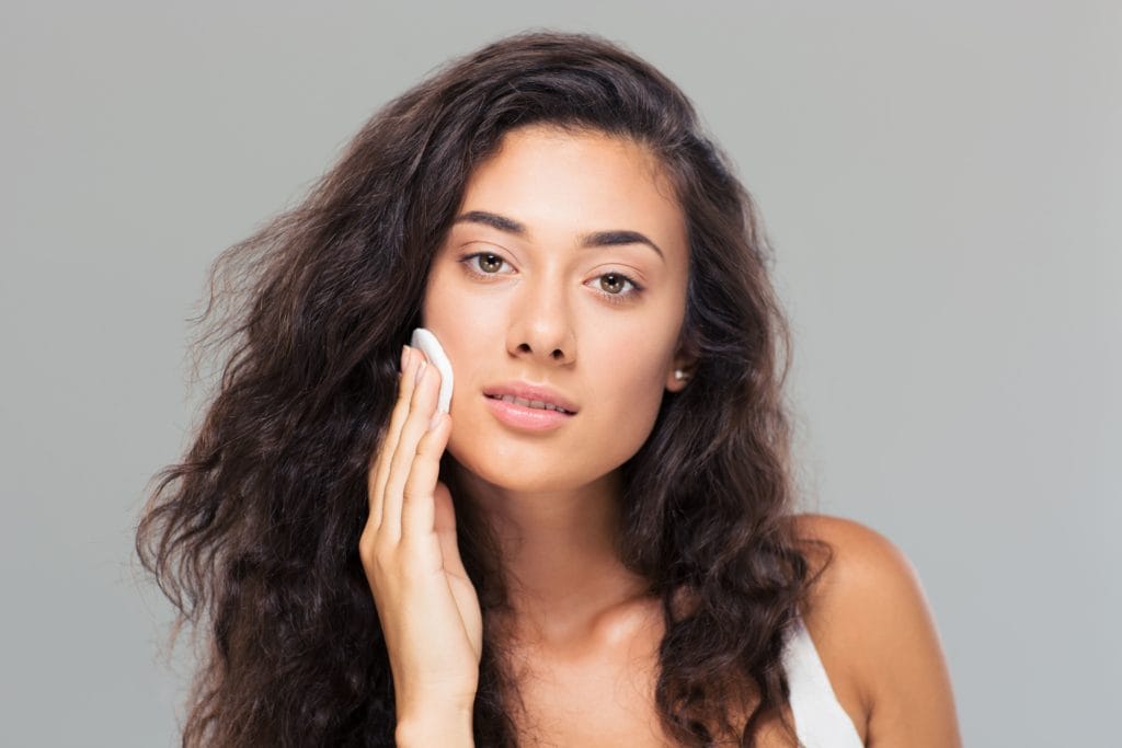 The Importance of Physical and Chemical Exfoliants 5 young cute woman with wadded disk SBI 300968022 1